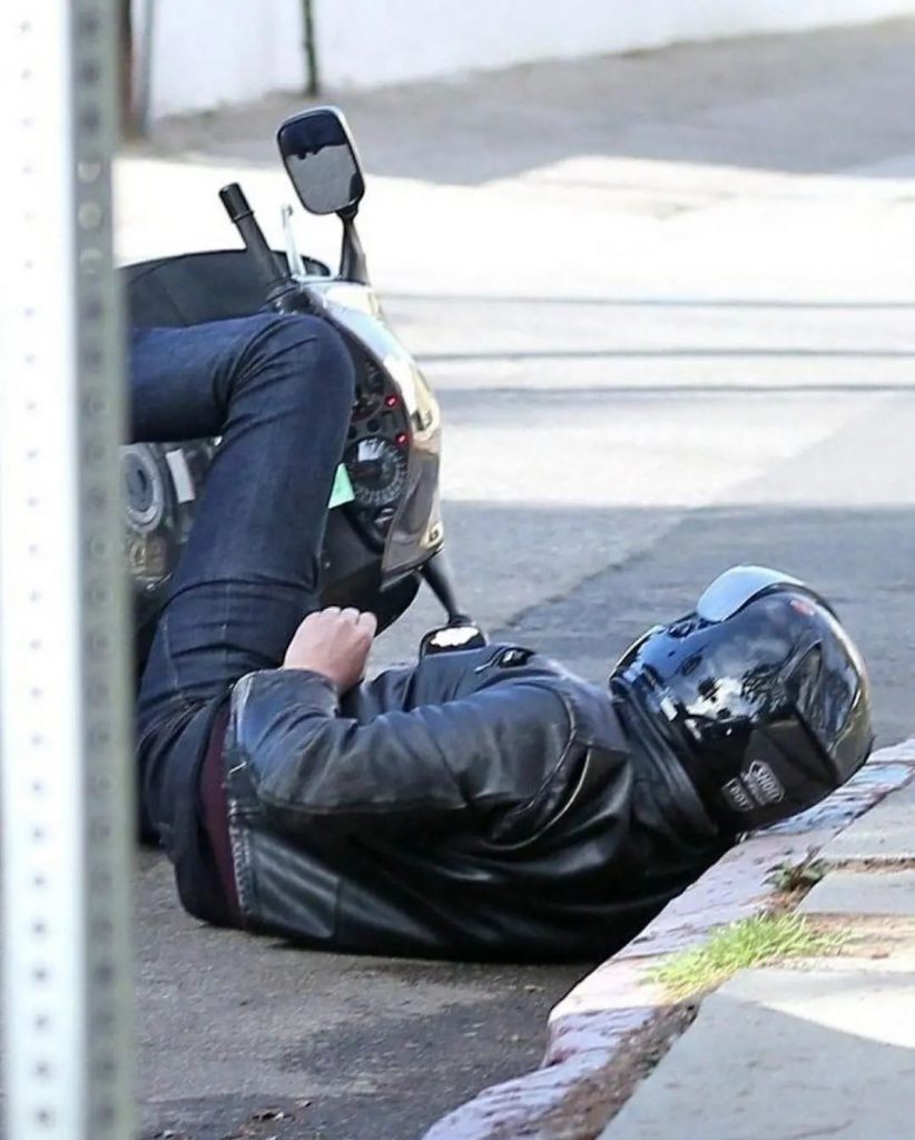 resting on the sidewalk is Ben Afleck